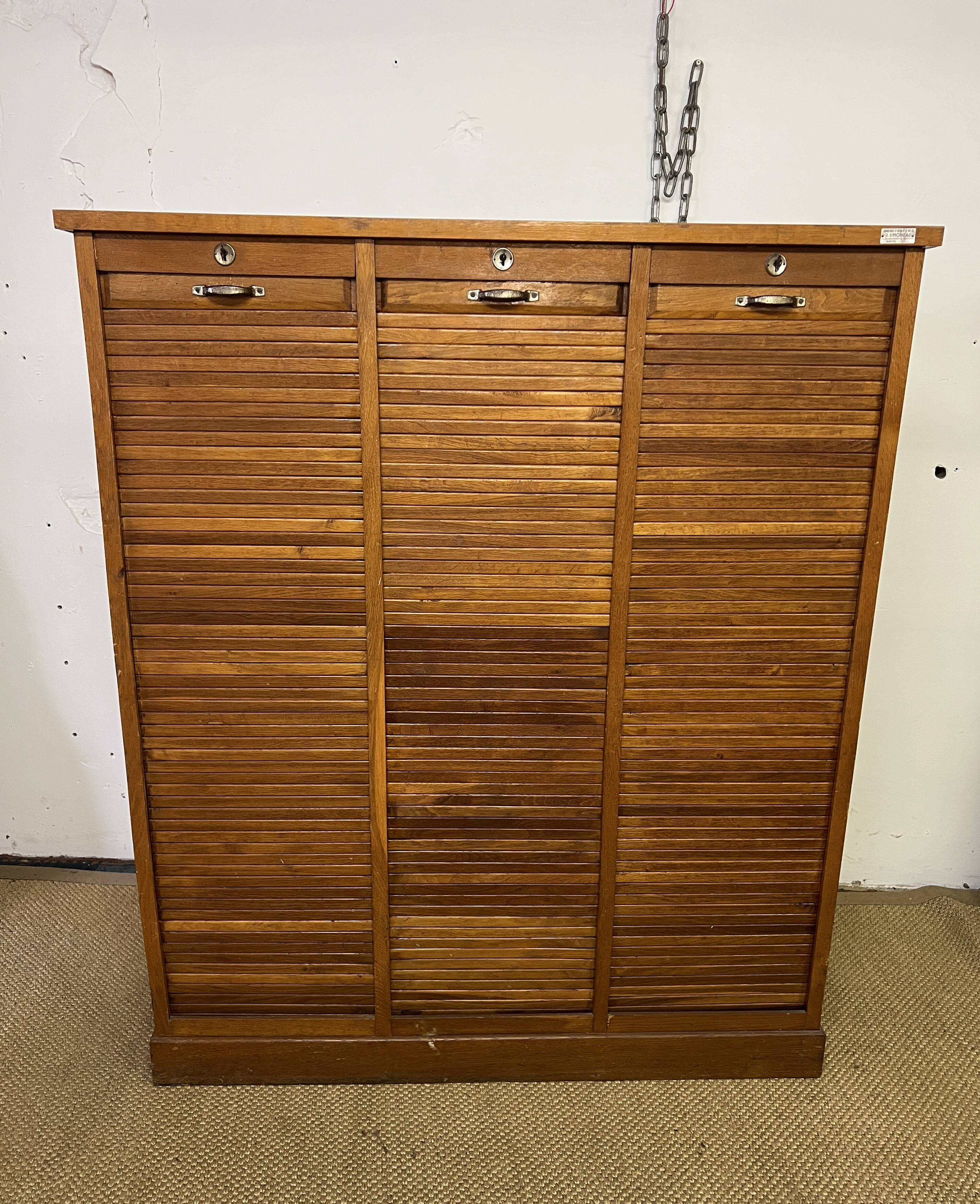 Old filing cabinet with triple curtains
