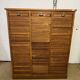 Old filing cabinet with triple curtains