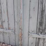 Pair of large wooden iron hanging shutters