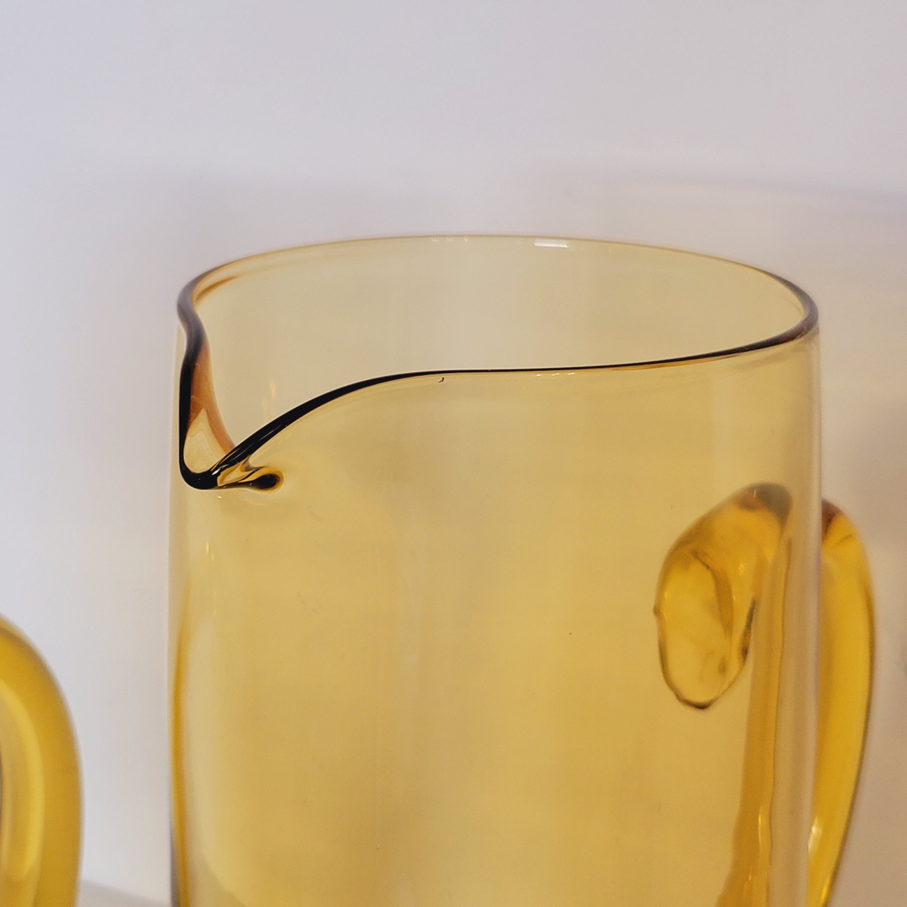 2 carafes in vintage amber yellow blown glass