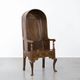 Antique English hooded lambing chair from the 18th century with hood shape