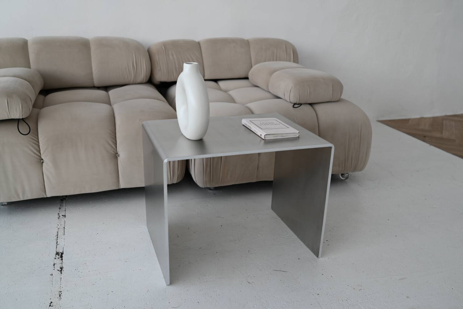 Minimalist brushed aluminum side table