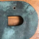 Ancient letter r sign metal painted