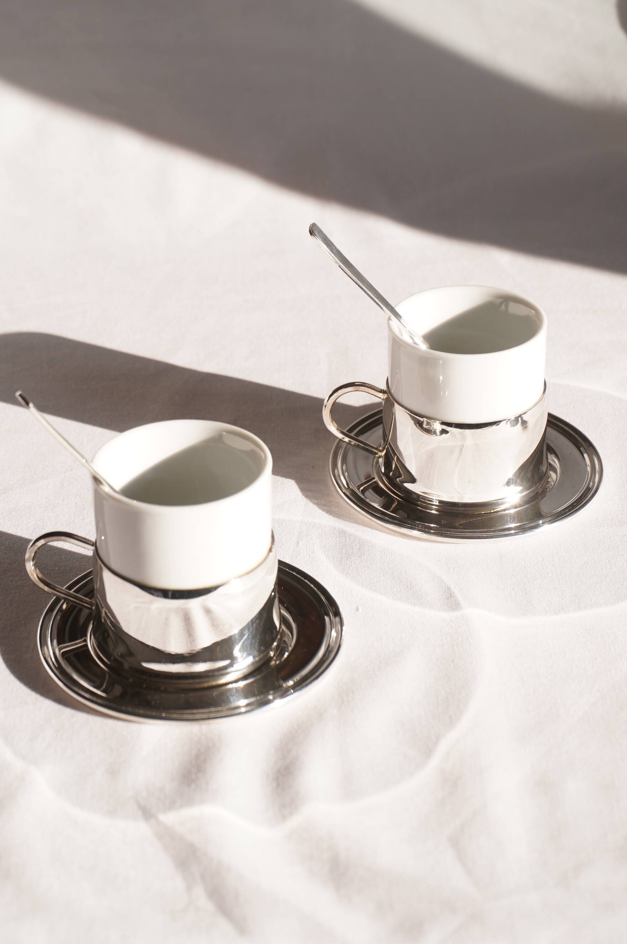 Silver-plated metal coffee service with a grape design.