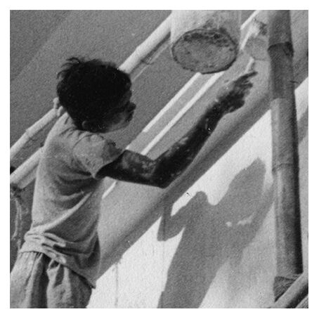 Young Indian perched on a scaffolding