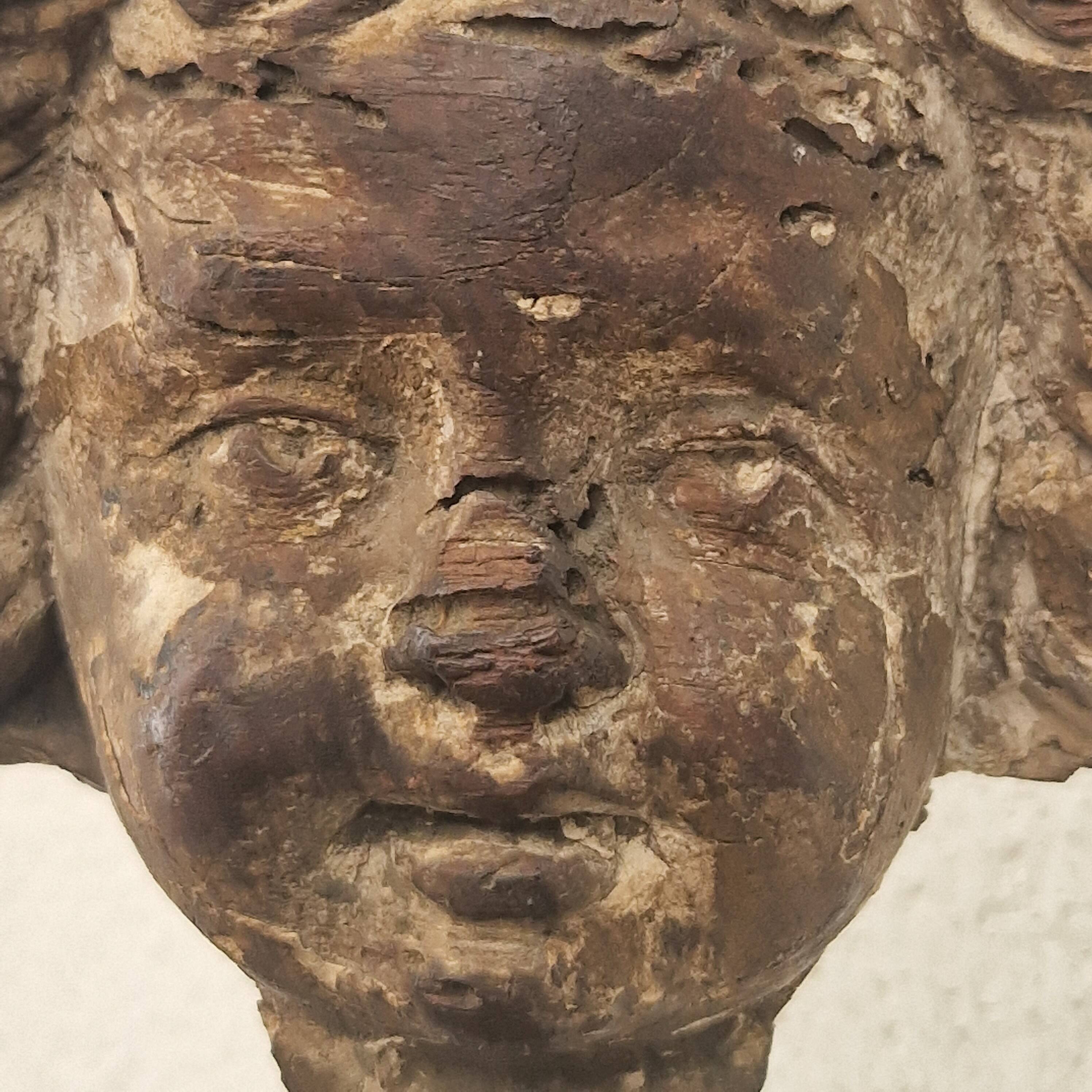 Sculpture. Ancient wooden angel head.