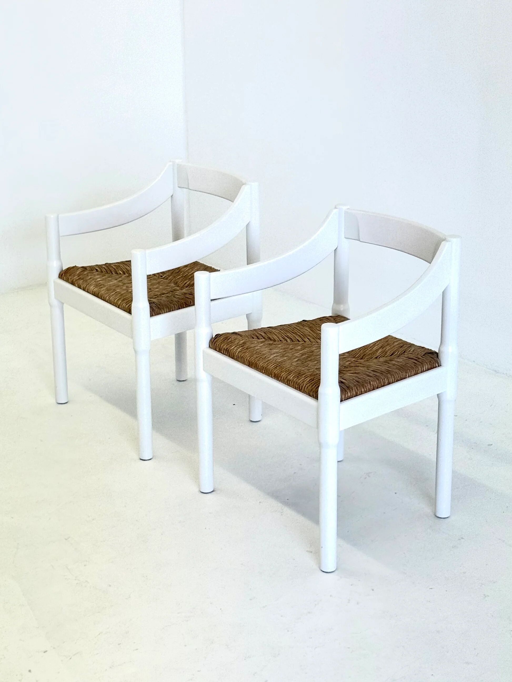 Set of two Carimate chairs by Vico Magistretti in white