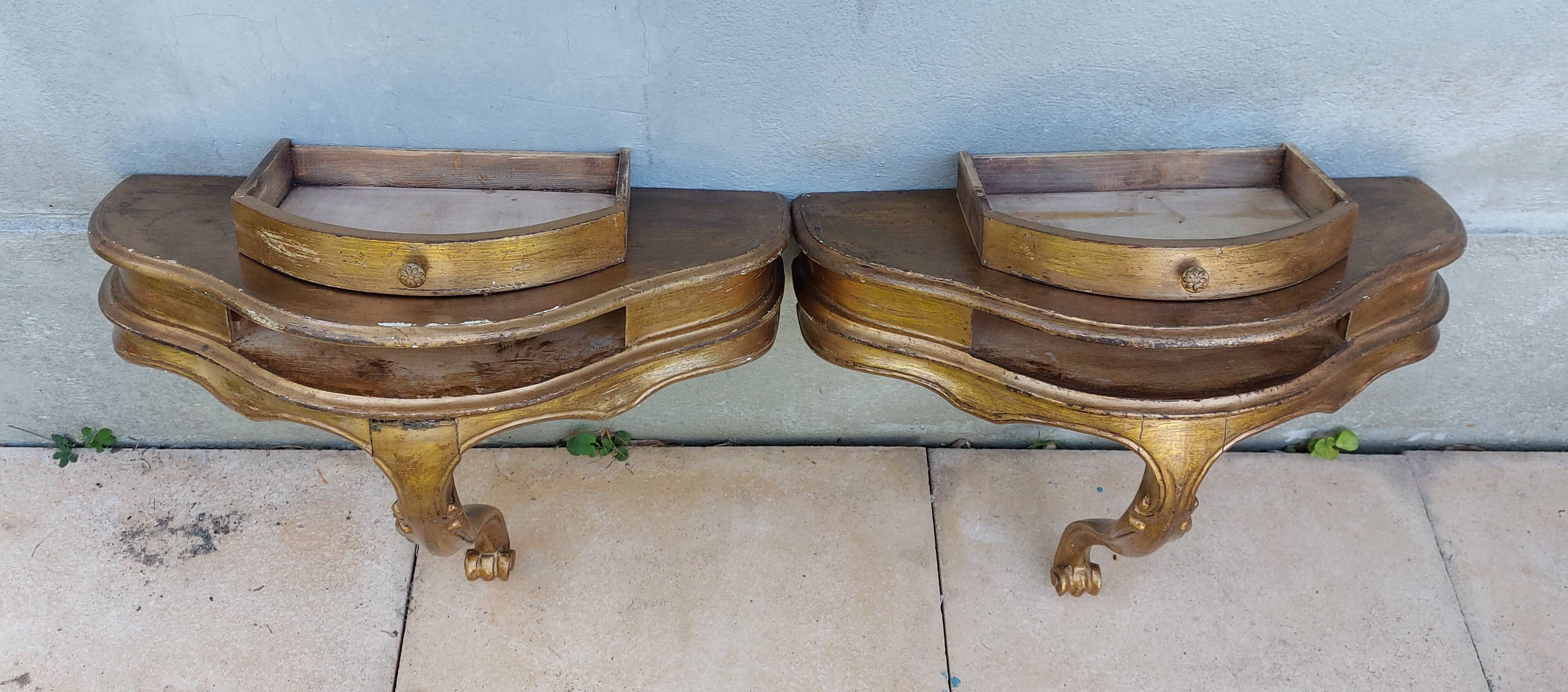 Golden patinated wall consoles