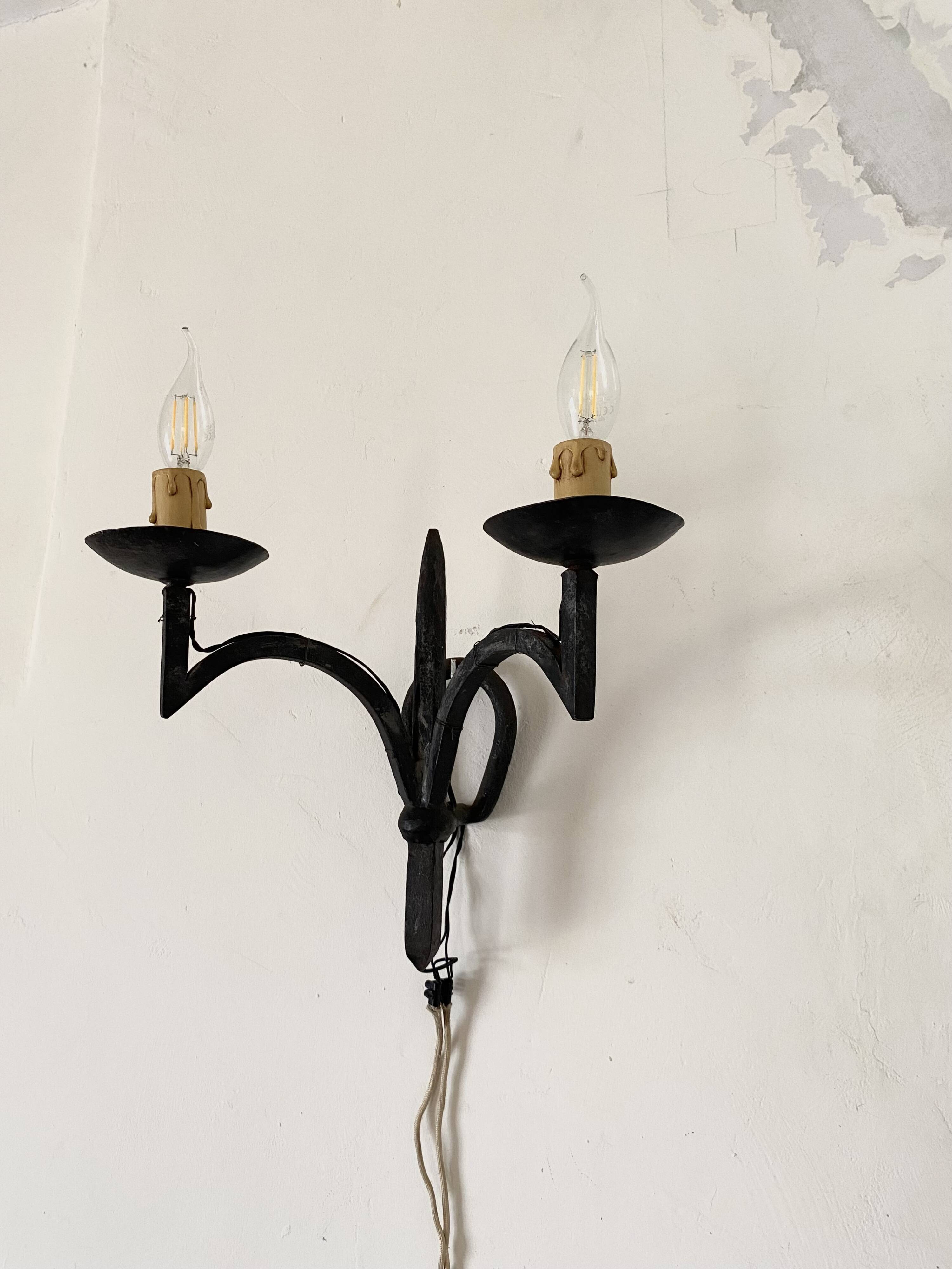 Wrought iron wall lights.