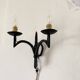 Wrought iron wall lights.