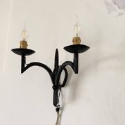 Wrought iron wall lights.