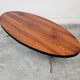 Danish Mid Century Modern oval coffee table with a teak top and chrome legs.