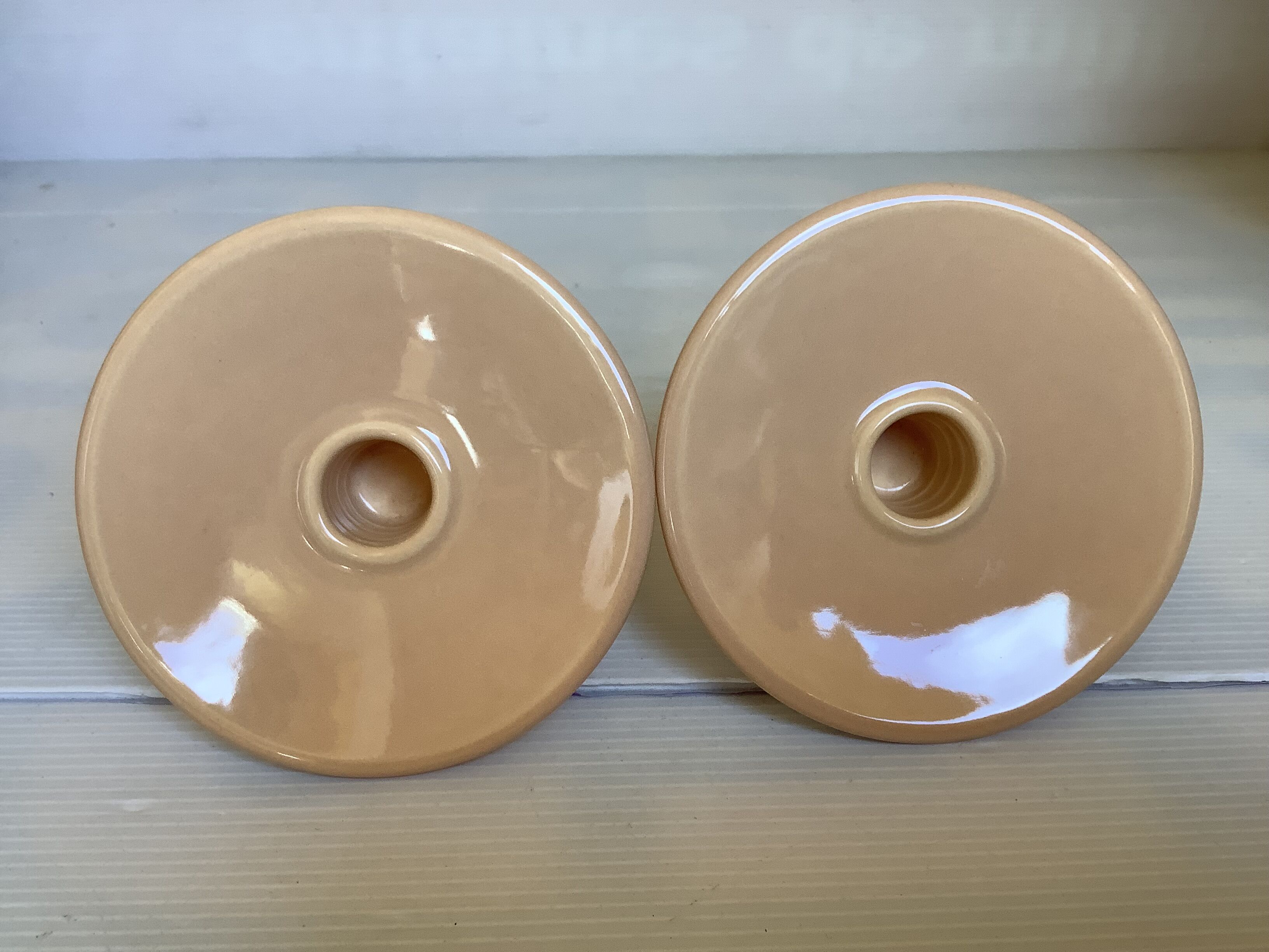 Pair of beige candlesticks
