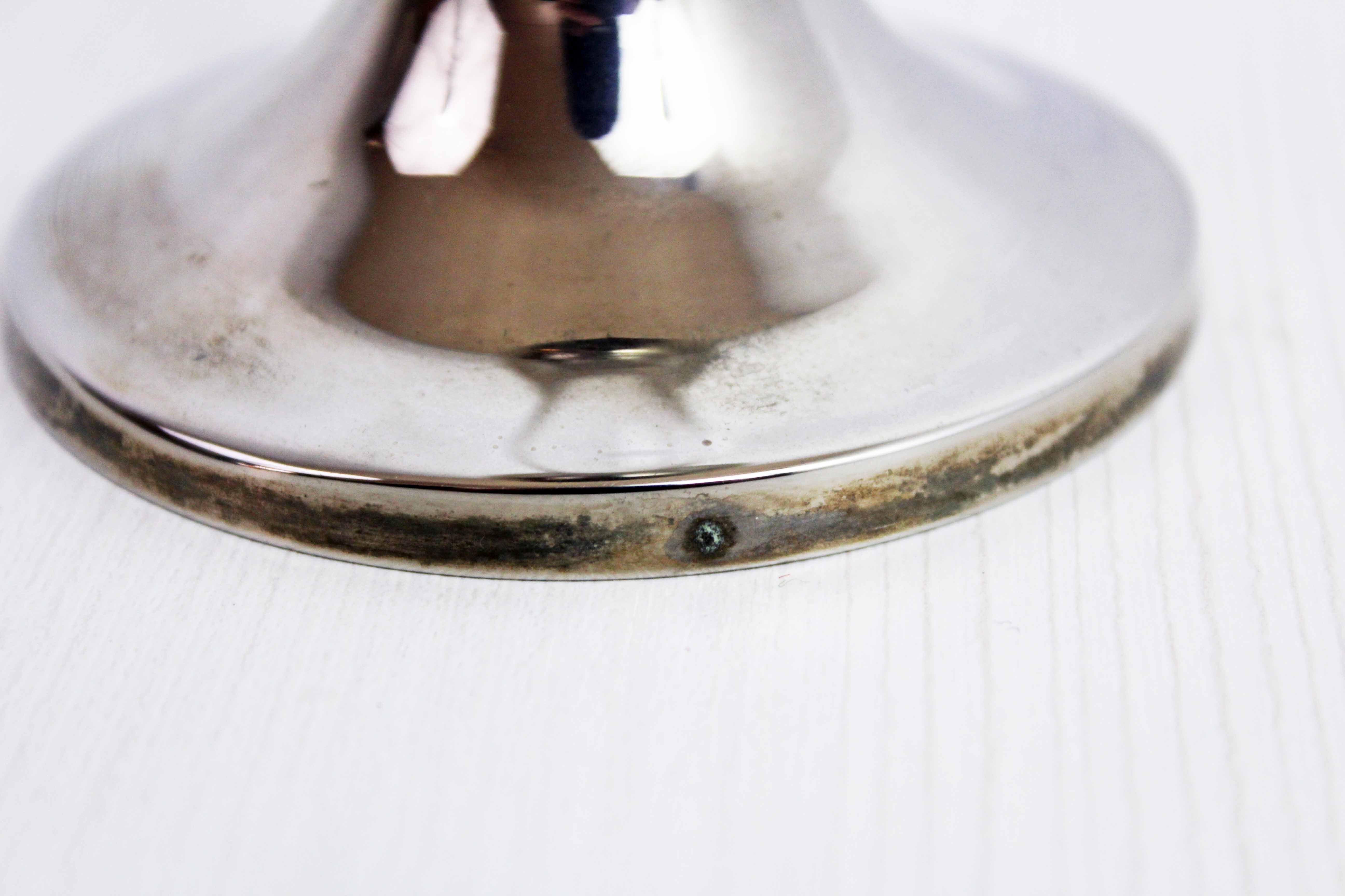 Candle holder in silver metal and lucite