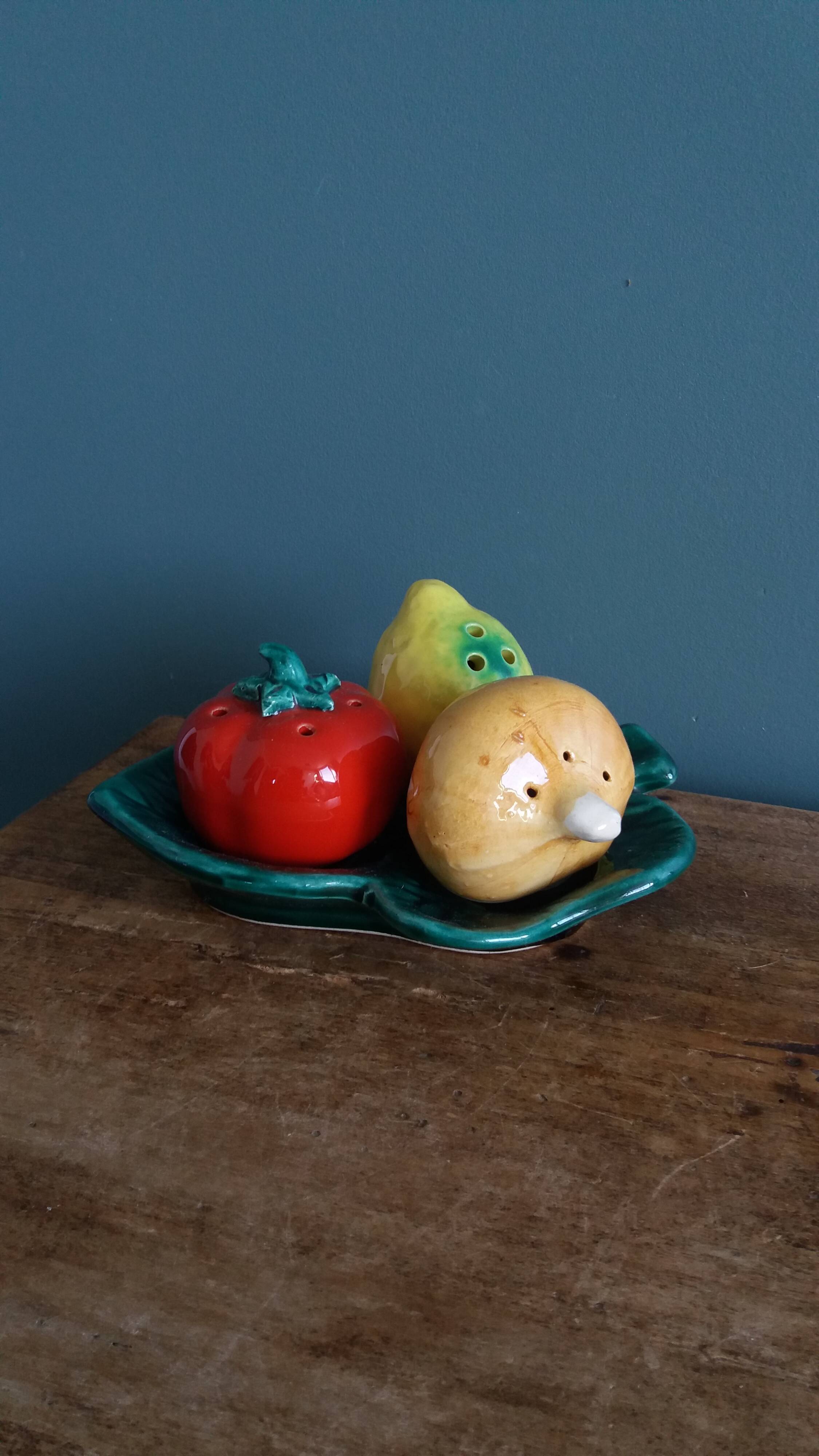 Salt and pepper shaker vegetables on a slipware leaf signed FPP Vallauris.