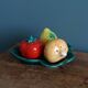 Salt and pepper shaker vegetables on a slipware leaf signed FPP Vallauris.