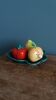 Salt and pepper shaker vegetables on a slipware leaf signed FPP Vallauris.