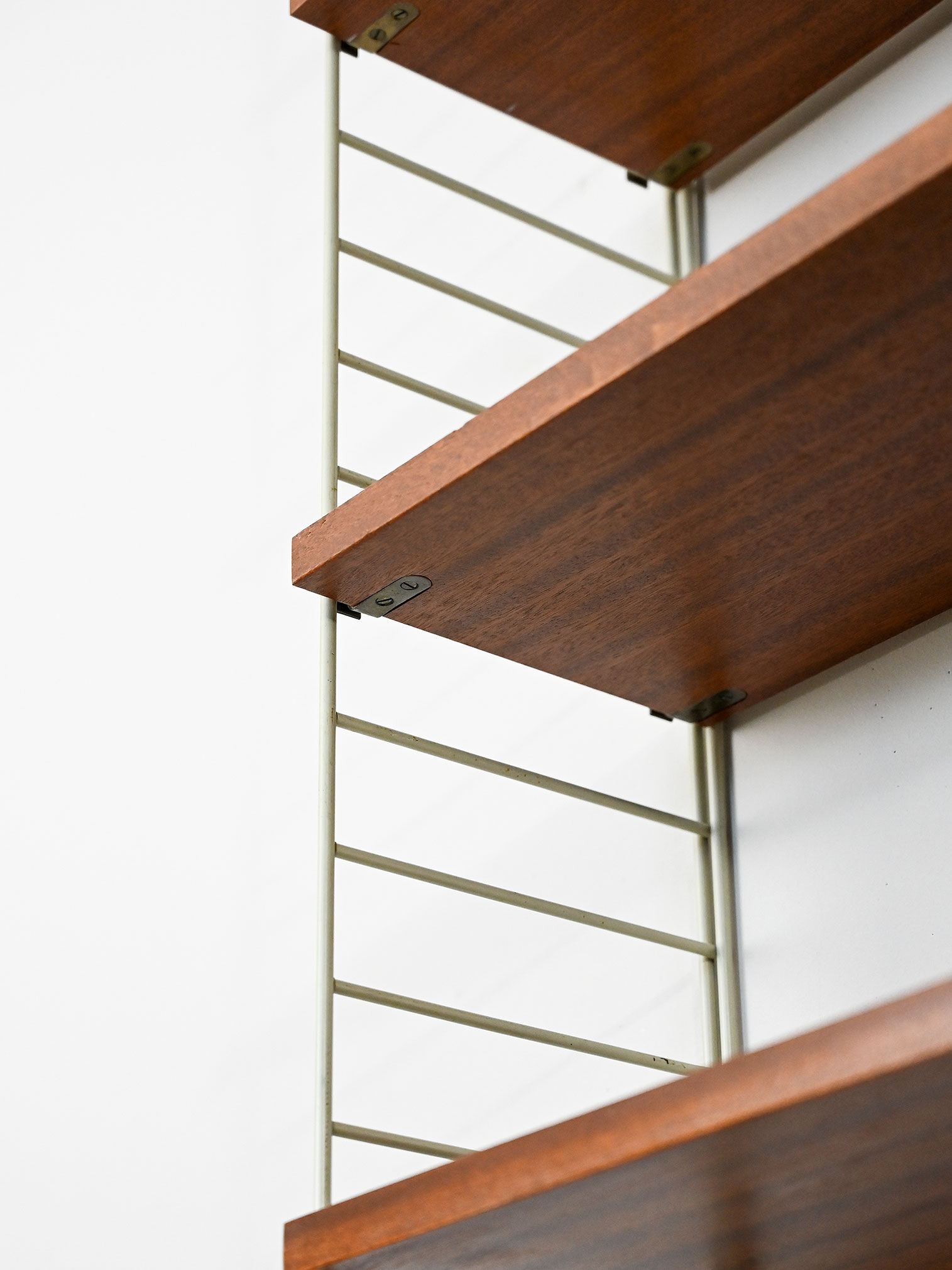 'string' bookcase with metal frame