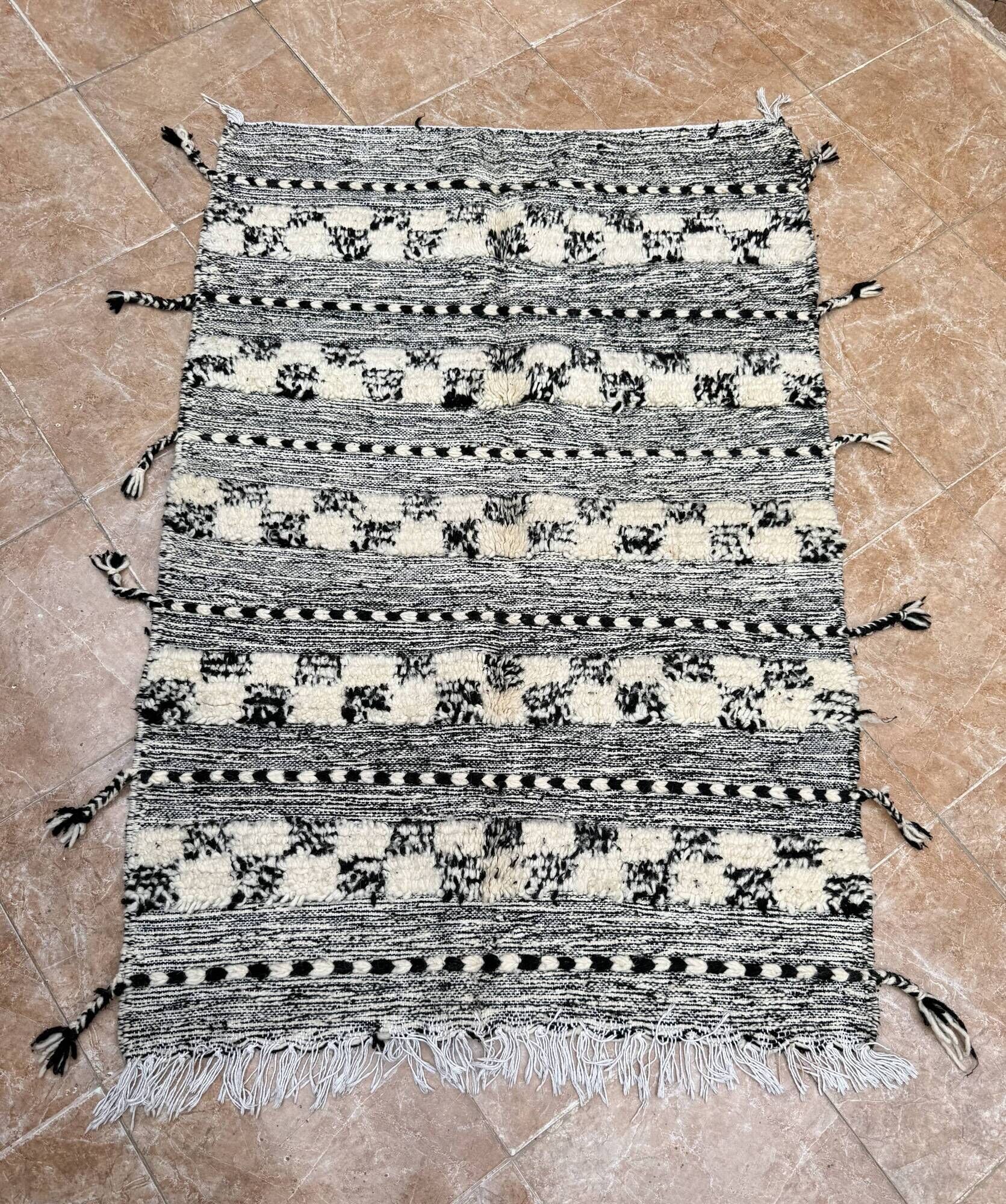 Small black Moroccan Berber Zanafi kilim rug for bedroom and living room.