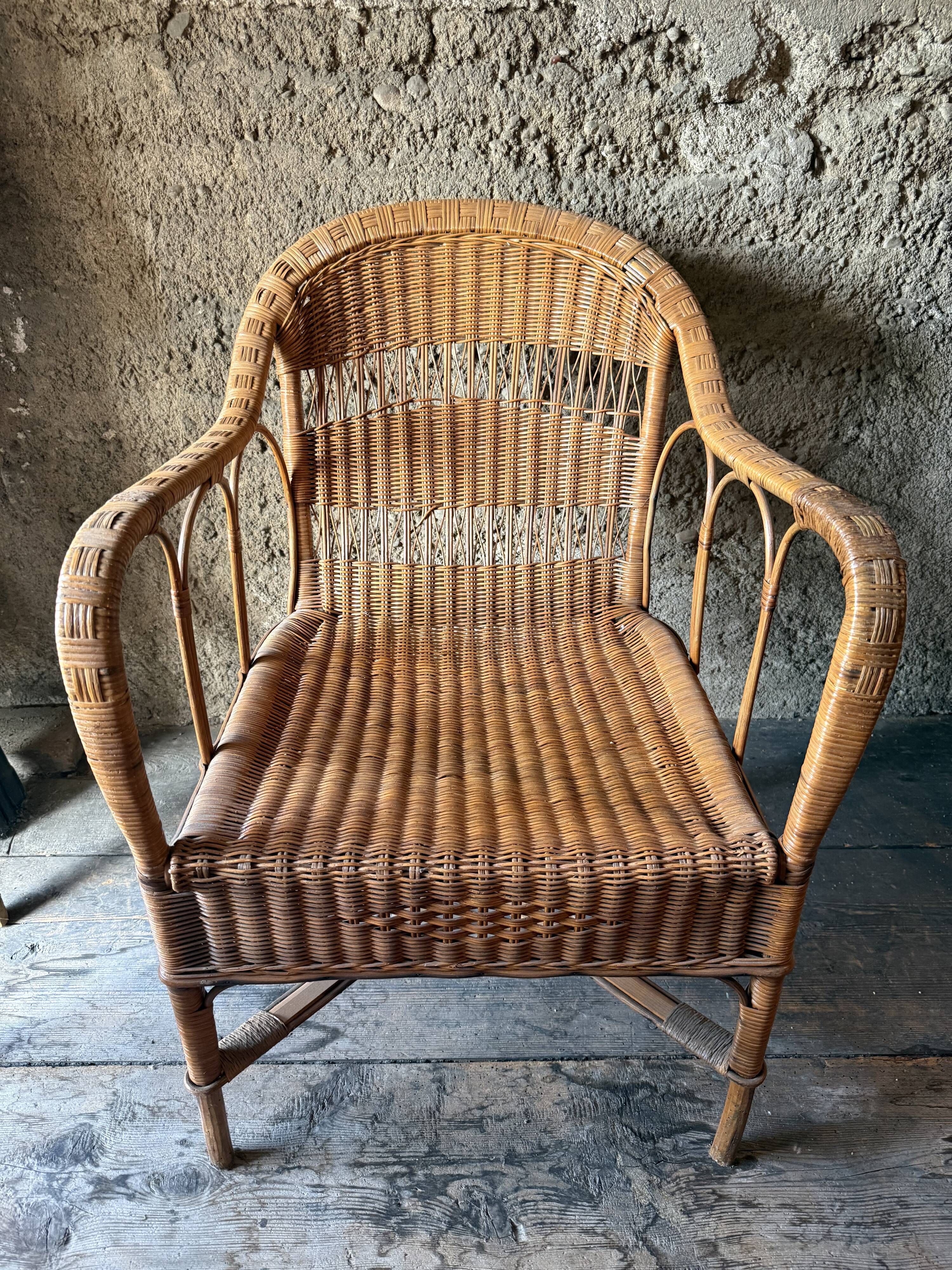 Vintage colonial lounge chair in rattan, pre-1950s.