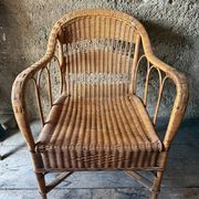 Vintage colonial lounge chair in rattan, pre-1950s.