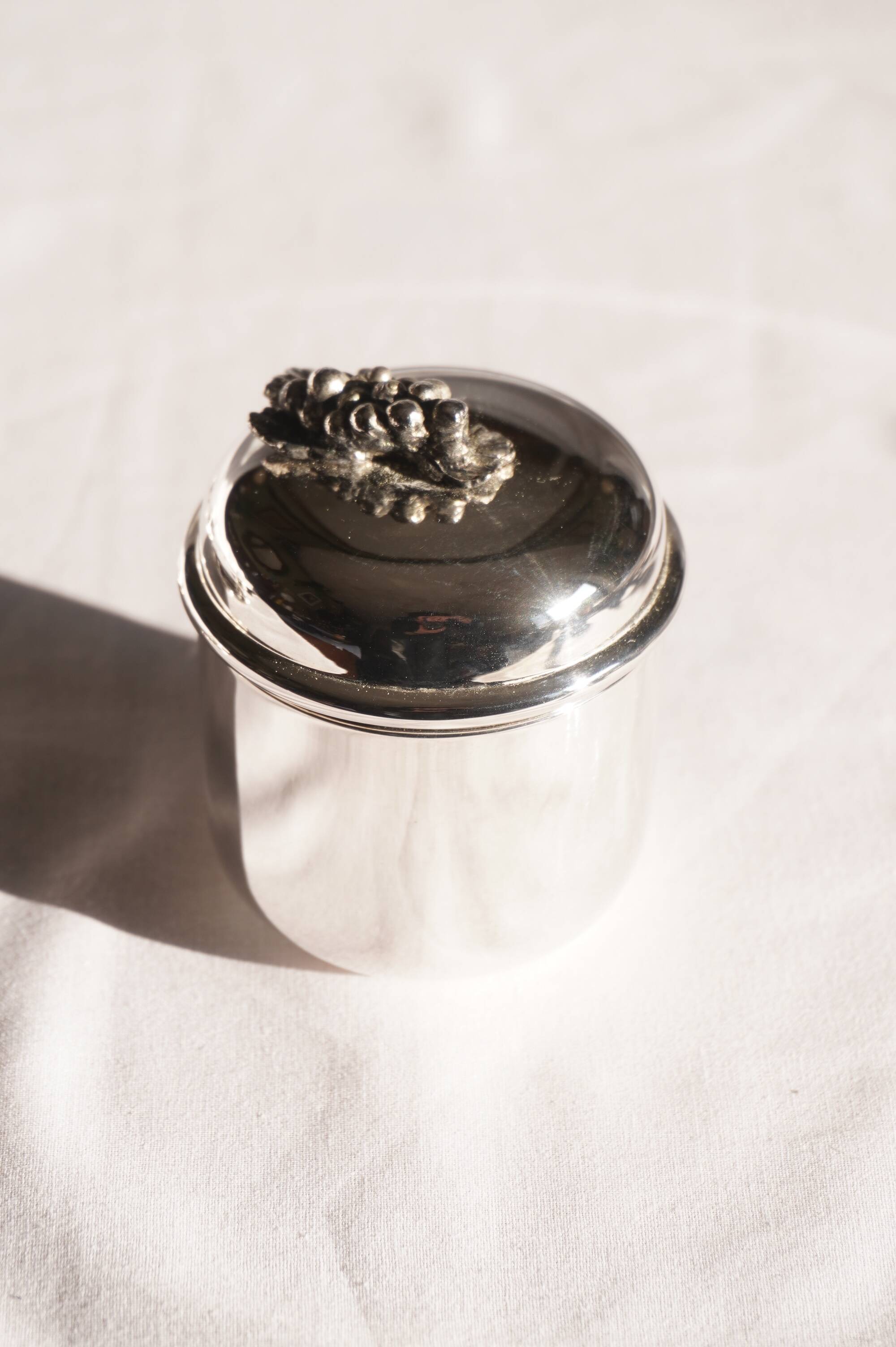 Silver-plated metal coffee service with a grape design.