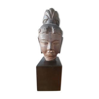 Head of Buddha on wooden base. Resin sculpture from Japan