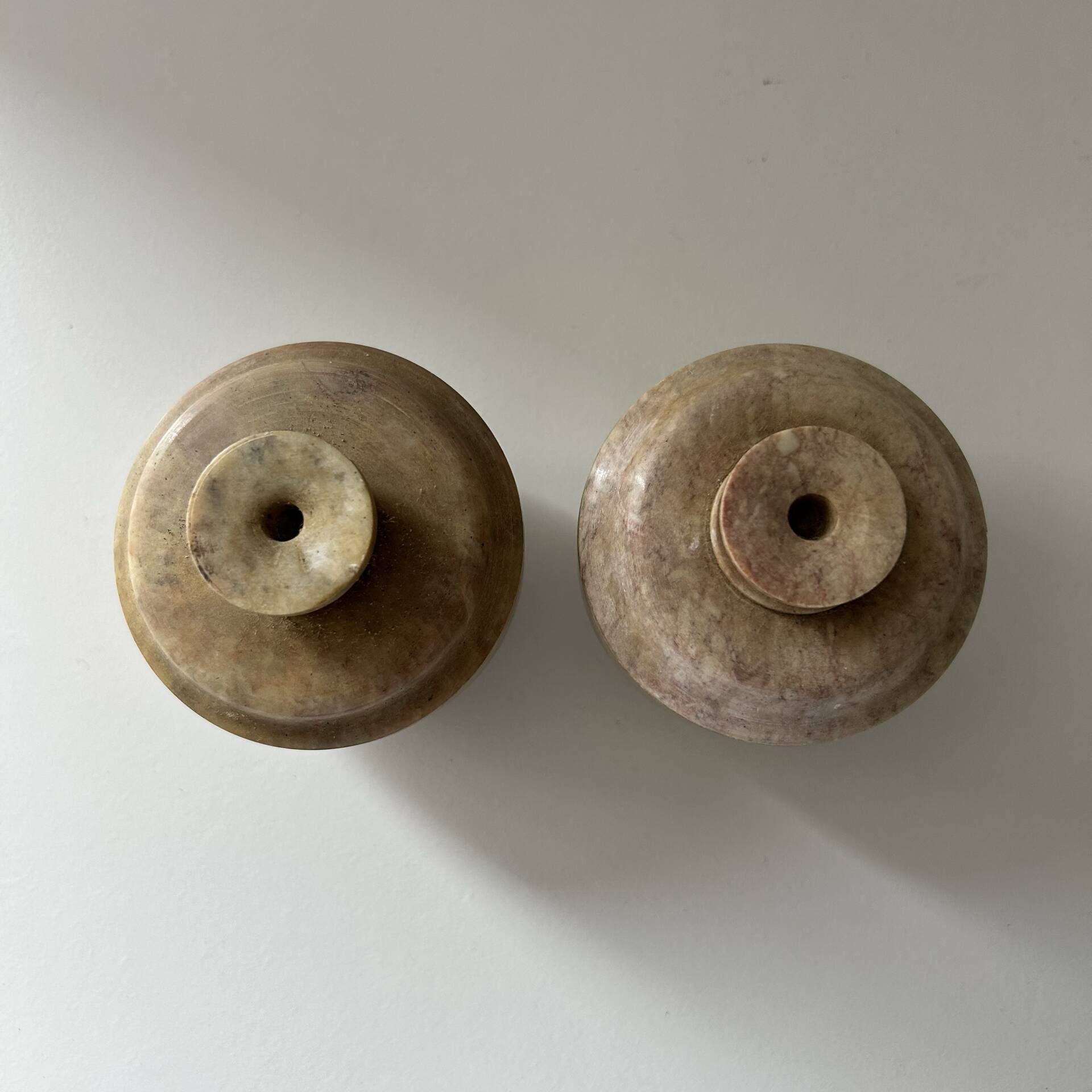 2 small stone urns