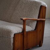 Modern Swedish two-seater independent sofa bed in pine and lambswool, 1950s.