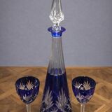 Cobalt blue double crystal service, consisting of a decanter and two matching glasses.