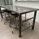 Industrial table with 6 pneumatic stools.