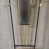 Wall-mounted coat racks in black and gold lacquered metal, circa 1950-1960