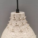 Ceramic hanging lamp in creamy white color that almost looks like a corral