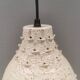 Ceramic hanging lamp in creamy white color that almost looks like a corral