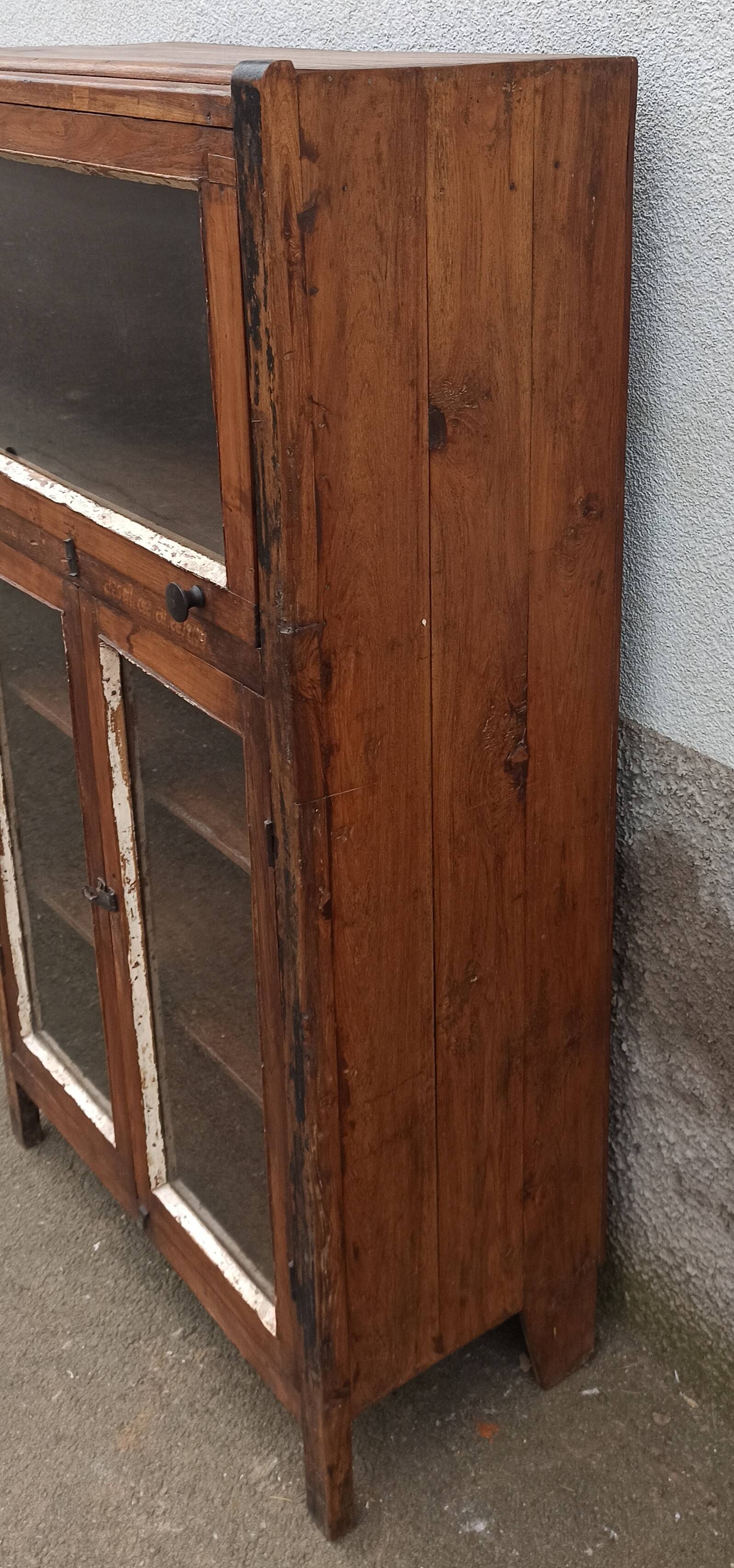 Small wooden glass cabinet with retractable door