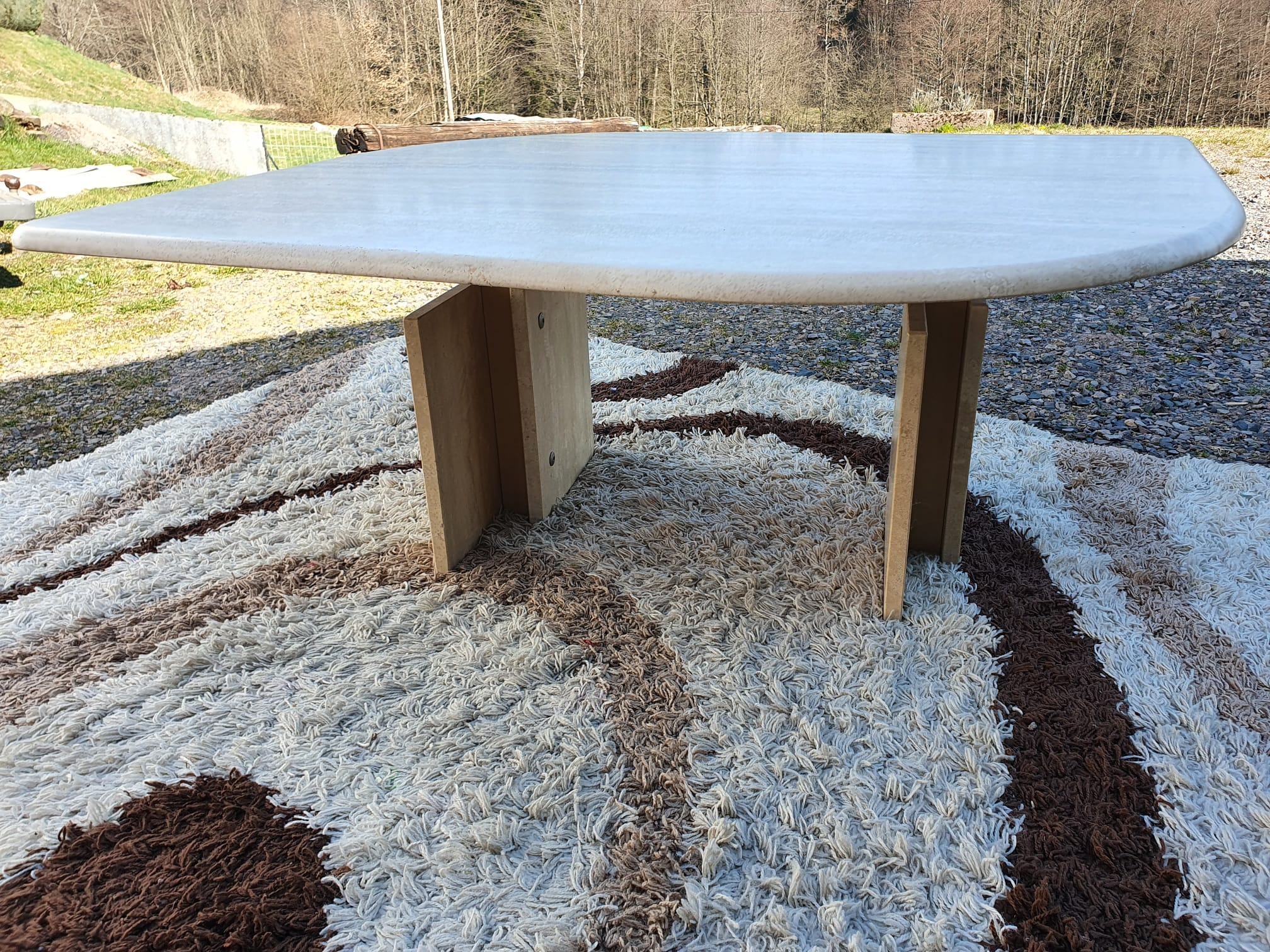 Adjustable travertine coffee table eye shape