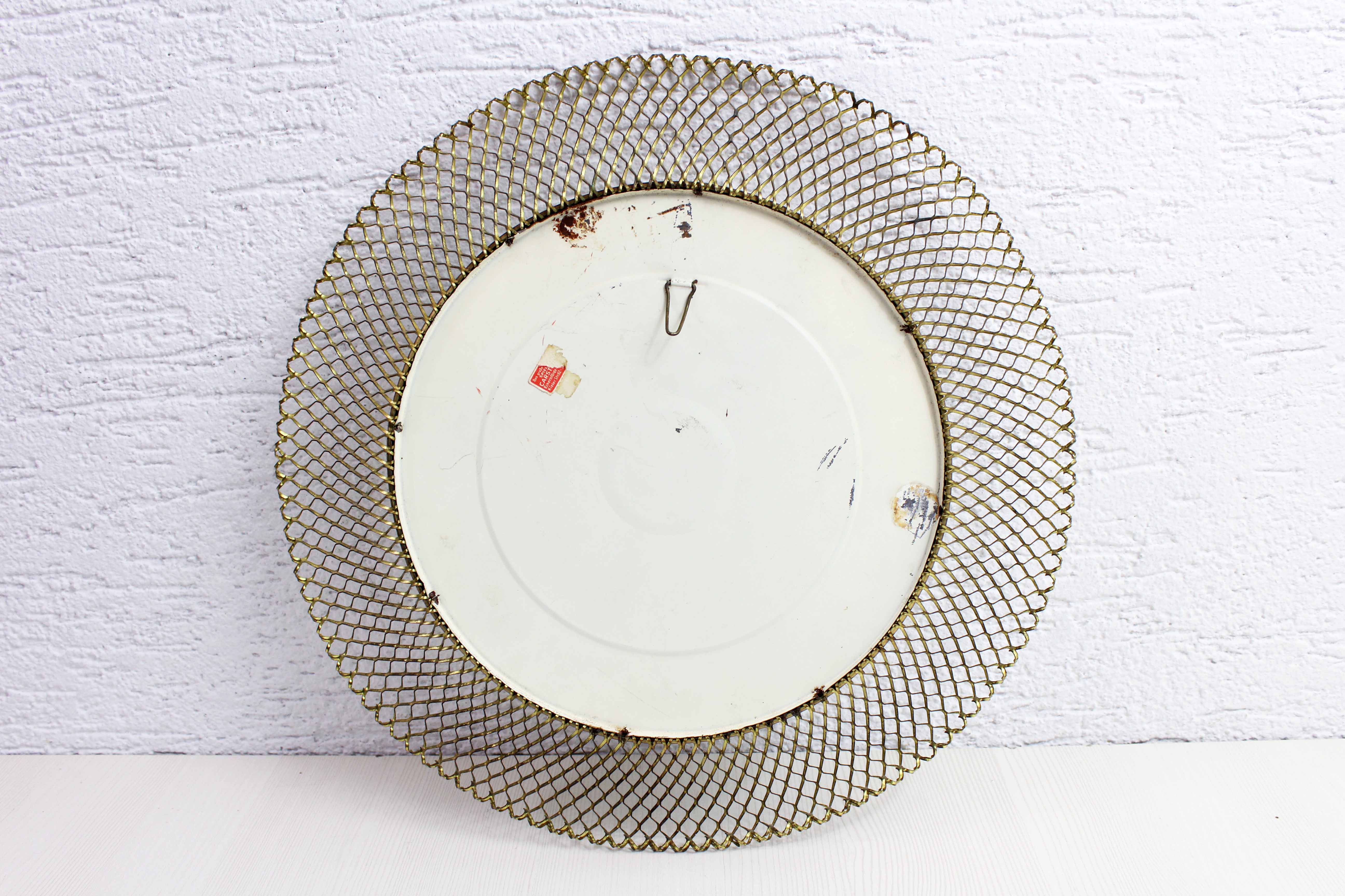 Vintage round mirror in gilded metal