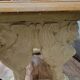 Table en pierre avec piètement à décor de protomes de lions ailés