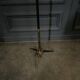 1960 floor lamp on gold metal winged base with black barrel