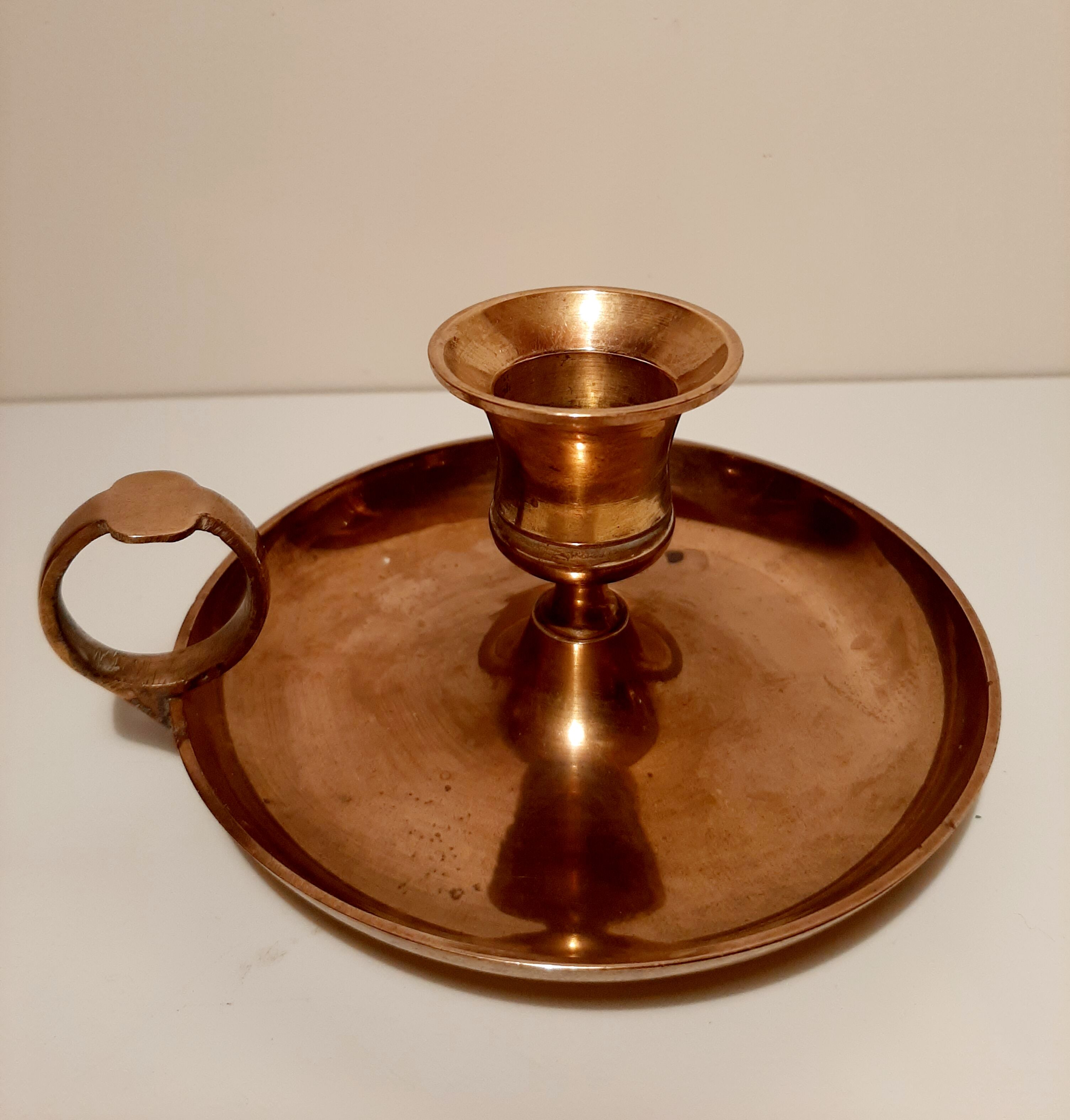Pair of brass hand candlesticks