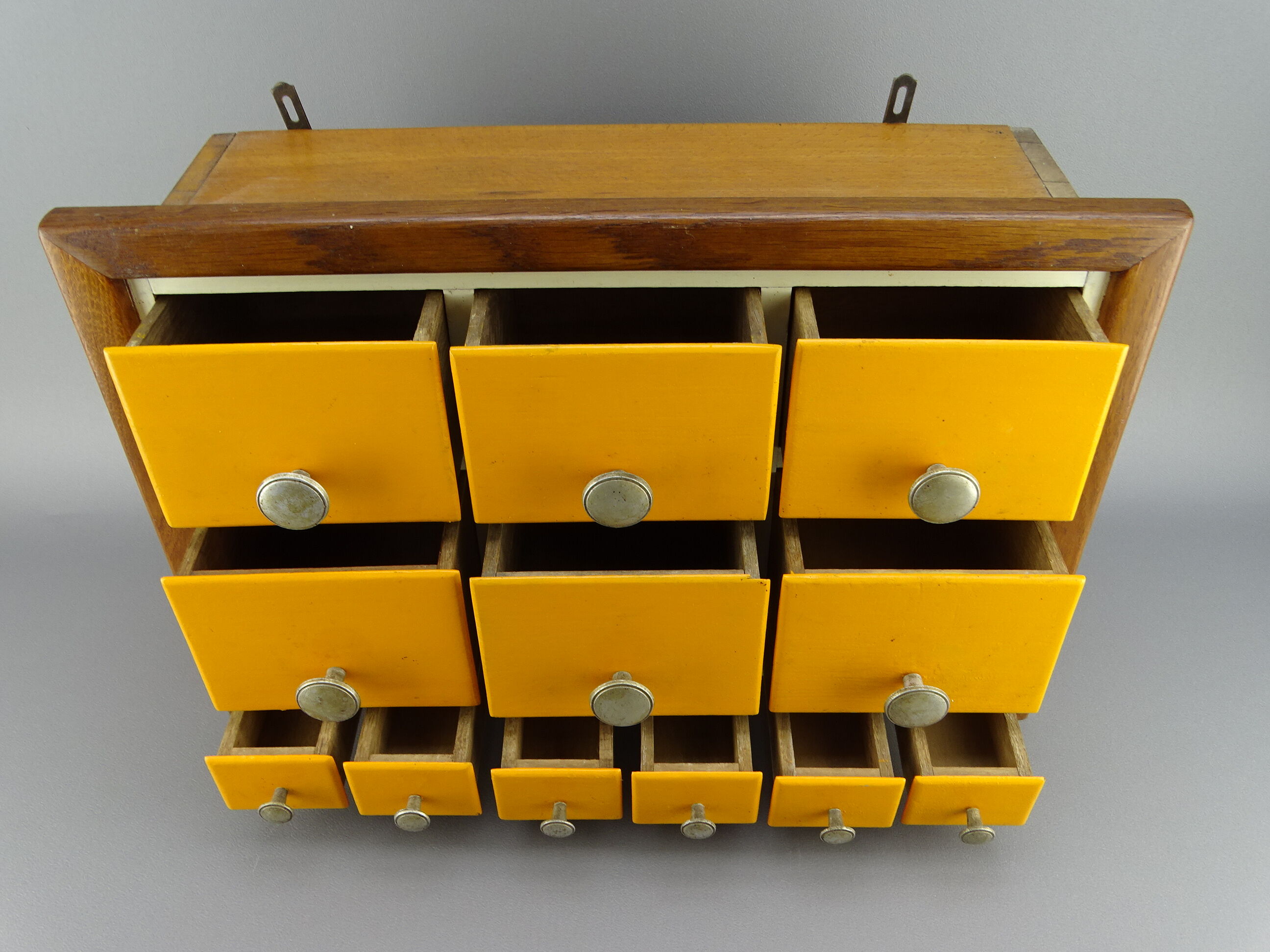 Cabinet loom shelf with drawer layette style