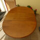 Solid wood round table with retractable extension