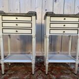 Pair of Louis XVI style bedside tables painted white.