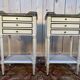Pair of Louis XVI style bedside tables painted white.