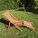 vintage wooden deck chair with striped fabric and footrest