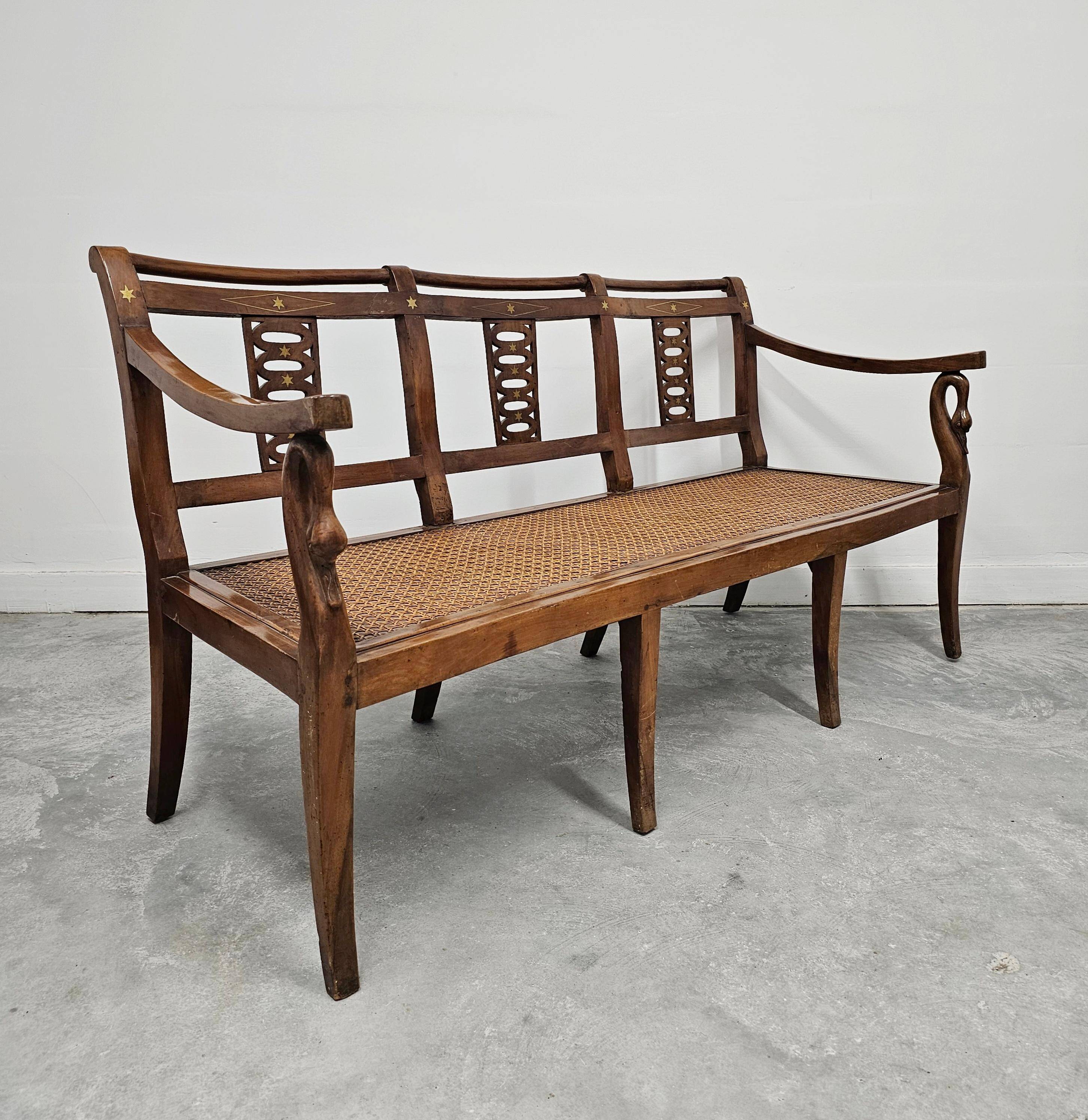Directoire canapé in walnut with brass inlays, late 18th century.