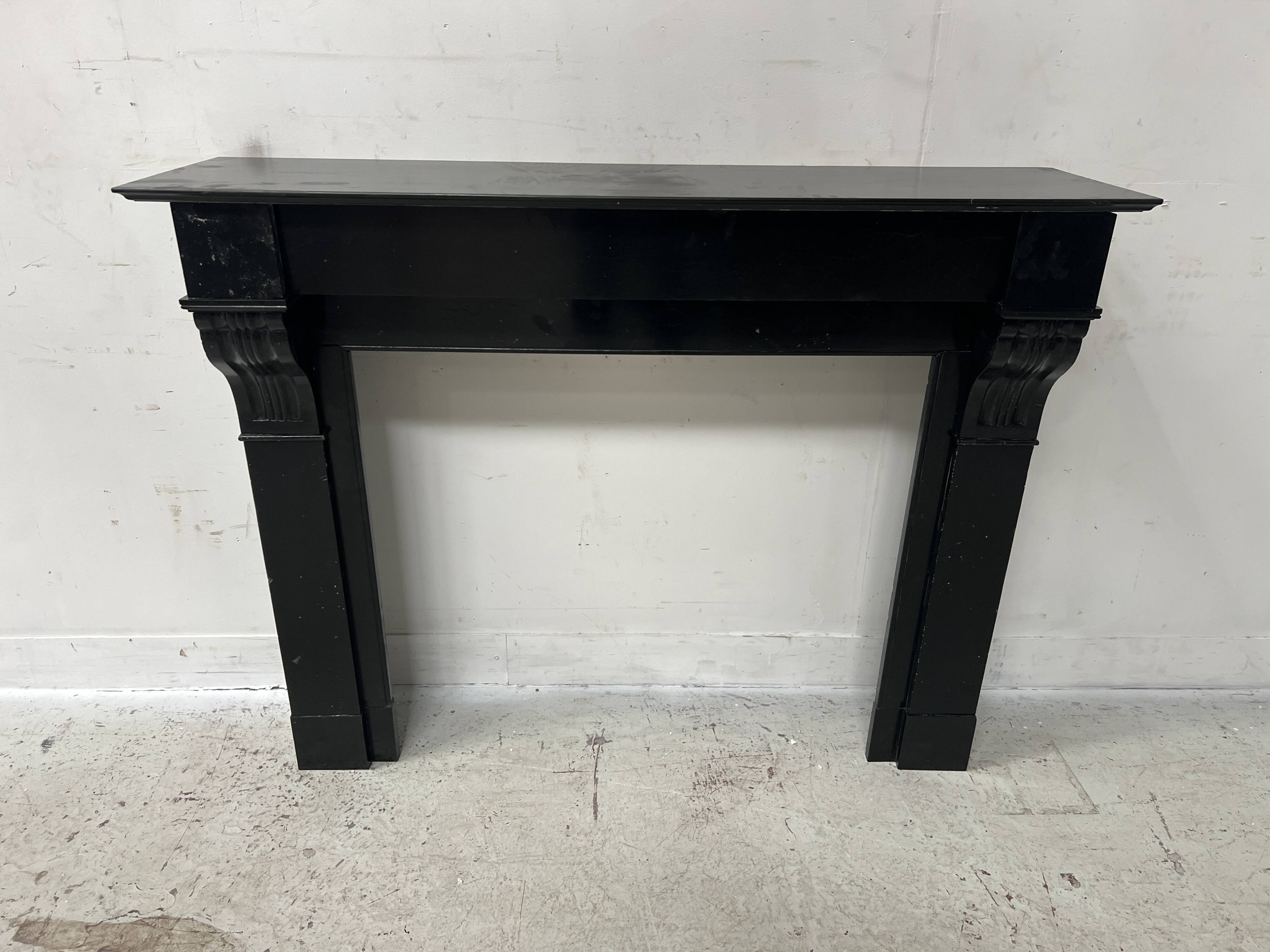 Napoleon III period fireplace with a black marble corbel. 19th century.