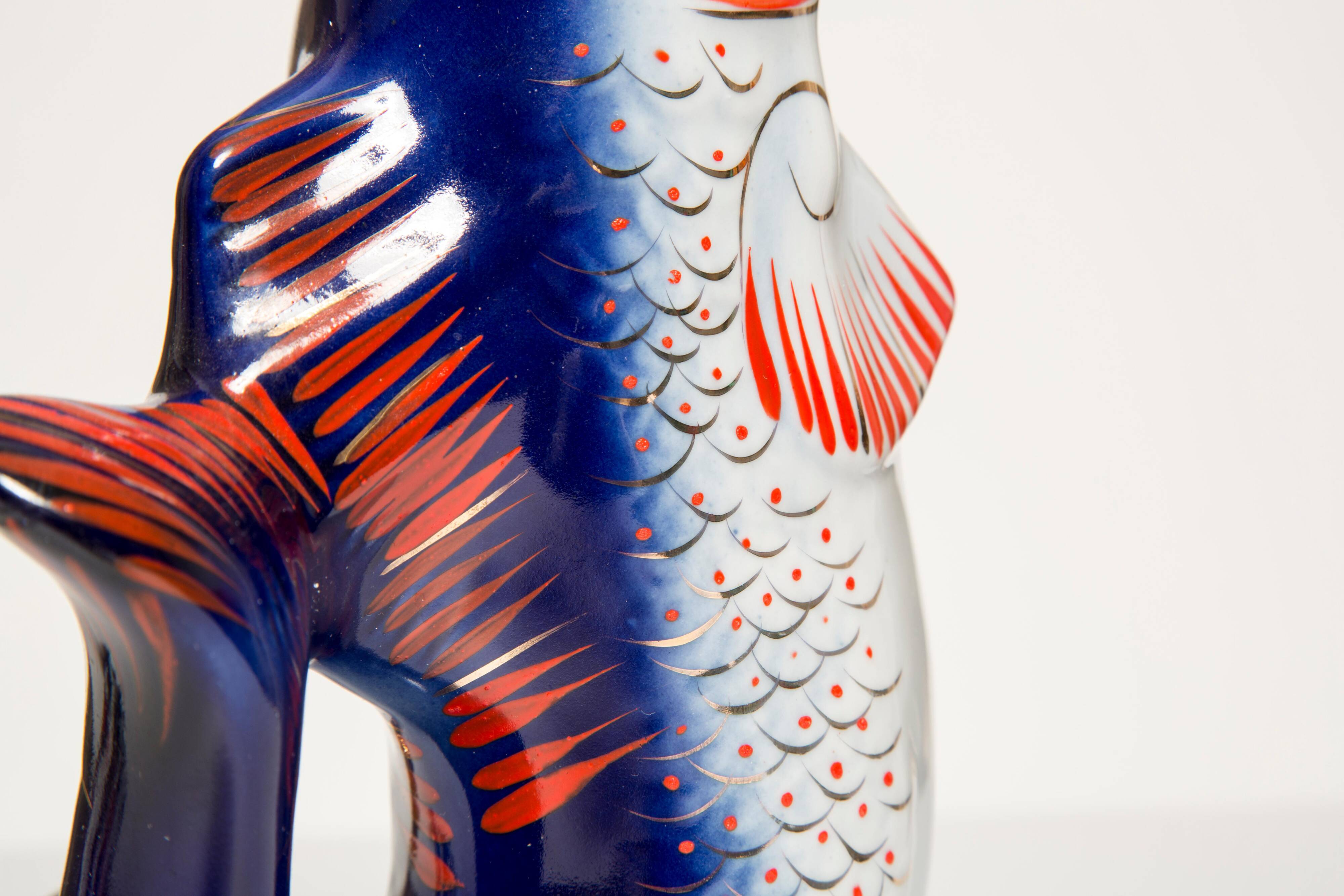 Set of 7 glasses and a glass carafe decorated with blue fish, Mid-Century Modern style, Europe, 1960s.