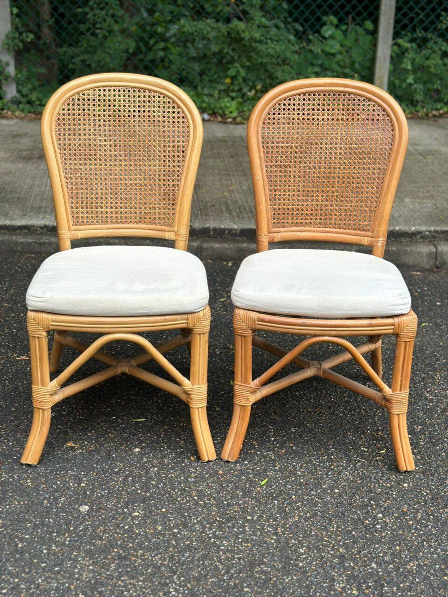 2 rattan and caned chairs in colonial bistro style from the 1990s.