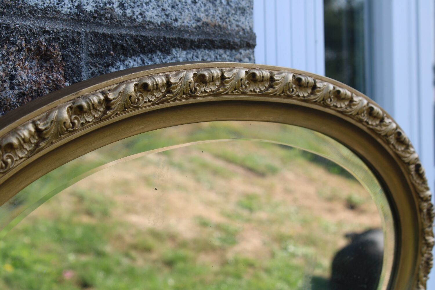 Bevelled oval antique mirror